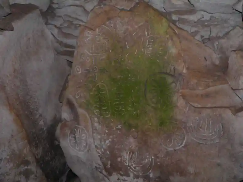 Solar disc on a stone on the grave of Jeremiah
